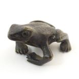 A cold painted bronze model of a frog. Approx. 2" long Please Note - we do not make reference to the