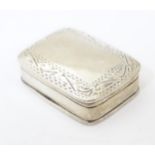 A .925 silver pill box with engraved decoration. Approx. 1 1/2" x 1 1/4" x 1/2" Please Note - we