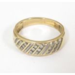 A 9ct gold ring set with 18 diamonds. Ring size approx. V Please Note - we do not make reference