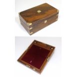 A late 19th / early 20thC walnut writing slope with brass mounts and a fitted interior with two