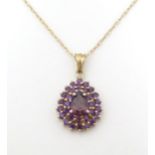 A 9ct gold necklace , the pendant set with amethyst, the chain approx 18" long Please Note - we do