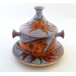 A Continental lidded tureen and charger with stylised fish decoration, signed Vence under. Tureen