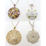 Four various silver / white metal necklaces with various pendants to include a silver gilt