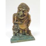 An early 20thC cast door stop / door porter depicting Mr Punch dressed as Julius Caesar. Approx. 12"