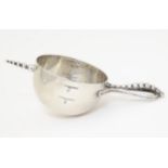 A silver plate spirit measure of cup form with beaded detail. Approx. 5 1/2" long Please Note -