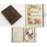 A Victorian photograph album, the card frames with floral borders, to include roses, lily of the
