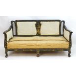 An early 20thC ebonised oriental sofa with mother of pearl inlay and painted frame. 65" long x 32"
