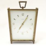 A mid century vintage mantel clock by Mauthe. 8" high Please Note - we do not make reference to