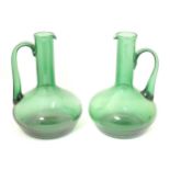 Two green glass jugs with provision for conversion to table lamps The tallest 10 1/2" high Please