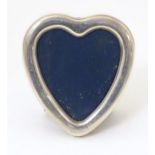 A photograph frame of heart form with a silver surround, hallmarked Sheffield 1989, maker Carrs of