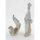 A Lladro figure of a woman holding a basket, Marketing Day, model no. 4502. Together with a Lladro