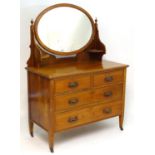 An early 20thC walnut Maple & Co dressing table with an oval mirror above a rectangular top above