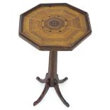An early 20thC oak occasional table with an octagonal top having parquetry inlaid decoration and