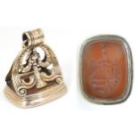 A 19thC yellow metal large pendant fob seal, the handle with urn and swag detail, the carnelian