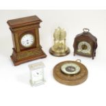 Assorted clocks to include a walnut cased mantle clock, Anniversary clock, carriage clock, aneroid
