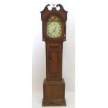 An oak cased long case clock with 30 hour movement and 12" painted dial, indistinctly signed. The
