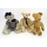 Toys: Three 20thC teddy bears with stitched noses, and articulated limbs and heads. The largest