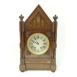 A Victorian Gothic revival mantle clock the architectural formed case with twin columns, trefoil