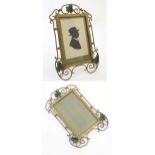 A pair of Victorian brass frames with scroll detail and enamel ivy leaf decoration. On with a