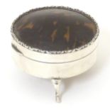 A silver ring box with tortoiseshell domed lid and standing on three outswept feet. Hallmarked