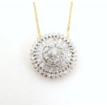 A 9ct gold necklace with 9ct gold pendant set with a profusion of diamonds. Pendant approx. 1/2"
