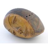 A studio pottery ceramic model of a stylised human head with pierced detail. Approx. 6 3/4" high