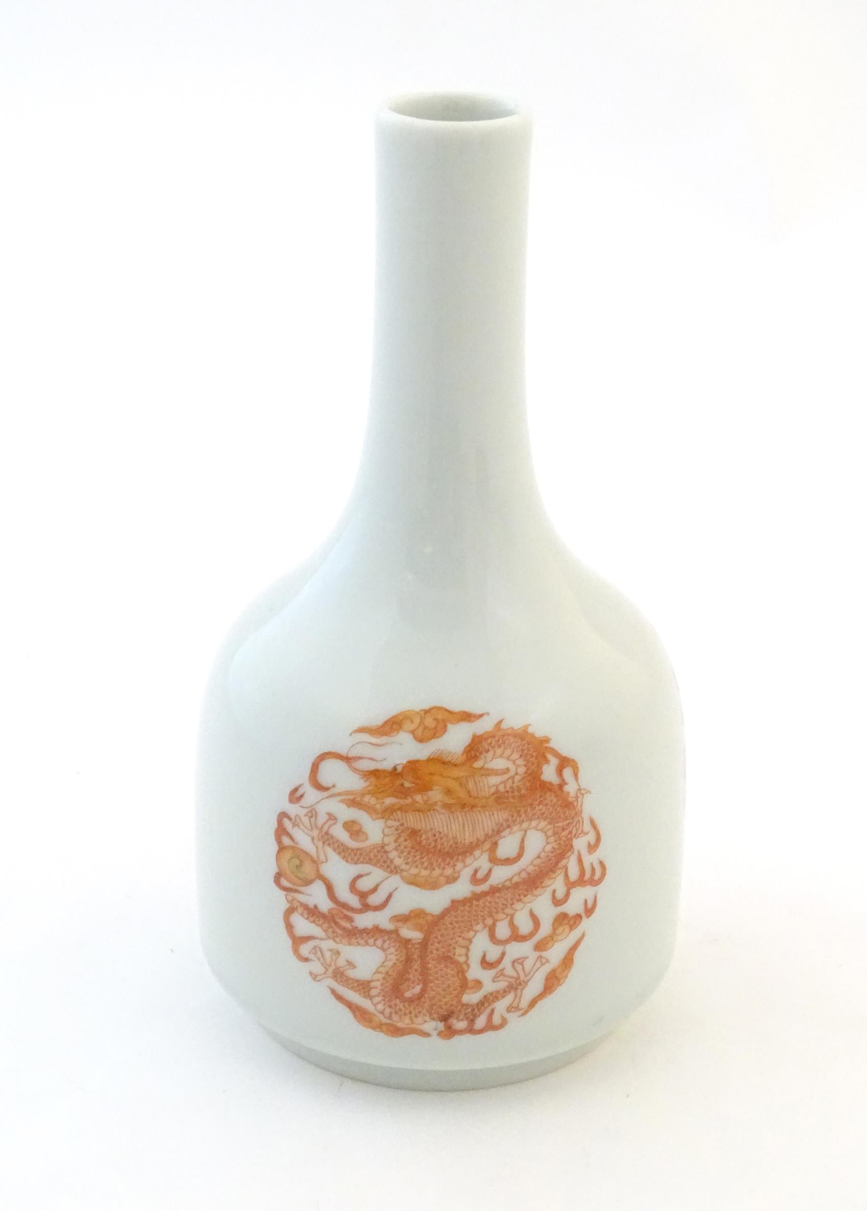 A Chinese bottle vase decorated with dragons and the flaming pearl amongst stylised clouds. - Image 5 of 6