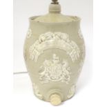 A 19thC stoneware rum ration barrel / flagon converted to a table lamp, the base of ovoid form and