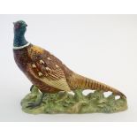 A Beswick model of a pheasant / game bird, model no. 1225. Marked under. Approx. 7 3/4" high