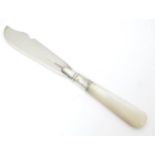 A silver butter knife hallmarked with mother of pearl handle. Hallmarked Birmingham 1919. Approx.