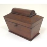 A late 19thC mahogany tea caddy of sarcophagus form with two lidded sections within. Approx. 7" high