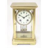 A French four glass and brass 8-day mantel clock stamped Japy Freres and H&H, striking on a gong and