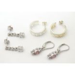 Three pairs of .925 silver earrings set with, two pair being drop earrings set with various