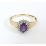 A 9ct gold ring set with central amethyst bordered by diamonds. Ring size approx. S Please Note - we