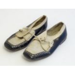 A pair of Continental black and white leather children's shoes. Marked Made in Spain under.
