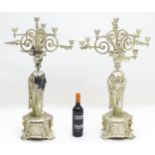 A pair of early 20thC candelabras, the caryatid column formed as a classical maiden surmounted by