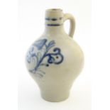 A Continental stoneware vase / jug with bulbous body and single handle, decorated with stylised