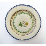 A pearlware plate with foliage and fruit to centre and banded borders. Approx. 7 1/2" diameter