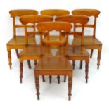 A set of six mid 19thC dining chairs with curved top rails above shaped seats and standing on turned