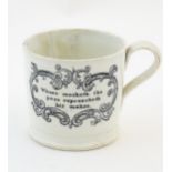 A proverb mug / cup with a scrolled cartouche with the verse: Whoso mocketh the poor reproacheth his