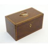 A 19thC mahogany two sectional tea caddy with inlaid marquetry / parquetry banding and fitted