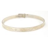 A silver bracelet of bangle form. hallmarked Birmingham 1989 Please Note - we do not make