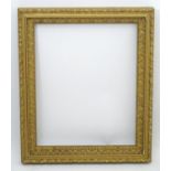 A 20thC gilt and gesso moulded frame with foliate detail. Approx. 25" x 20" Please Note - we do