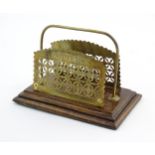 A Victorian brass letter rack with pierced and foliate decoration. Approx. 4 1/2" x 6 3/4" x 4"