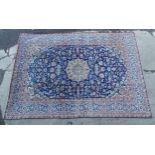 Carpet / Rug : An Isfahan carpet, the blue ground with central medallion and floral and foliate