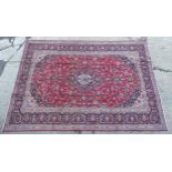 Carpet / Rug : A Kashan carpet, the red, blue and cream ground with central medallion and floral and