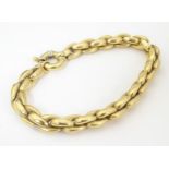 An 18ct gold bracelet. Approx. 7 1/2" long Please Note - we do not make reference to the condition