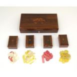 A 19thC rosewood games box, the lid decorated with playing card suits opening two reveal a fitted
