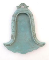 A Chinese incense holder / dish of stylised bell form with relief temple bell style decoration.