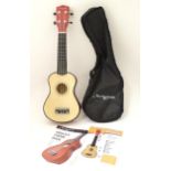 Musical Instrument: a Martin Smith UK212A soprano ukulele, with guide, chord book and soft case.